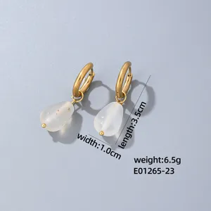Gold hoop earrings detail view featuring elegant translucent teardrop pendants for refined style.