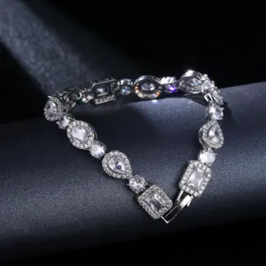 Detailed macro view of silver bracelet with multi-shape zirconia stones on dark base