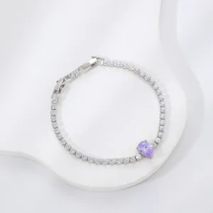 Elegant copper bracelet with clear zircons and a central purple pear-shaped stone