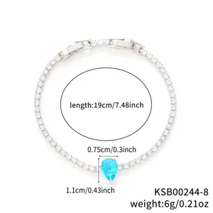 Macro view showing detailed dimensions of teardrop blue stone tennis bracelet.