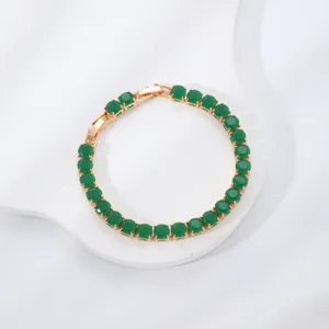 Close-up detail of the gold-tone round green zircon tennis bracelet showcasing fine craftsmanship.