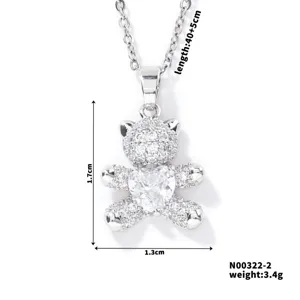 Detail view of teddy bear pendant necklace with heart stone and 1.7cm height measurement