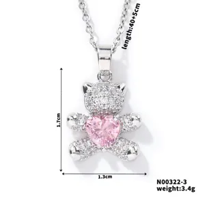 Macro detail of pave-set teddy bear necklace with pink heart showing 1.7cm height