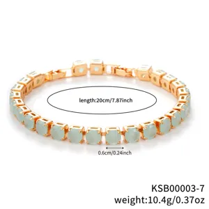 Gold-tone tennis bracelet featuring light green round zircon stones and extension clasp.