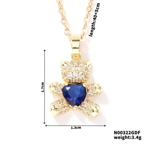 Detail view of teddy bear necklace with blue heart stone and dimensions