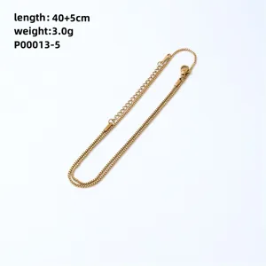 Detailed view of a gold-toned box chain necklace with lobster clasp and extension