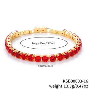 Close-up detail of the gold-plated red zircon tennis bracelet, sparkling red stones.