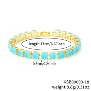 Close-up detail of the elegant gold-plated tennis bracelet with vibrant blue round zirconia stones.