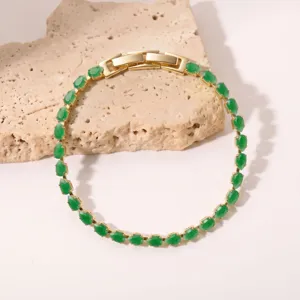 Elegant gold-plated tennis bracelet featuring vibrant green teardrop cubic zirconia