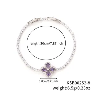Minimalist silver-tone four-leaf clover bracelet with purple cubic zirconia stones.