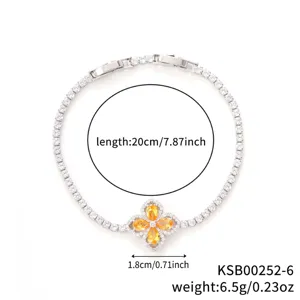 Elegant silver-finish tennis bracelet featuring an orange zirconia four-leaf clover charm