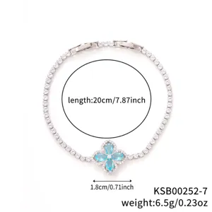 Elegant silver clover bracelet featuring light blue and white cubic zirconia stones