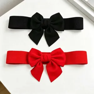 Two wide elastic waist belts in black and red with large decorative bows for dresses.