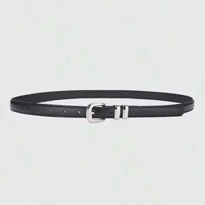 Black thin leather belt detail showing the sleek silver-colored metal buckle and clean edge finish.