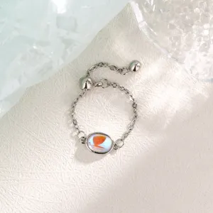 Minimalist silver adjustable drawstring chain ring with an iridescent oval stone