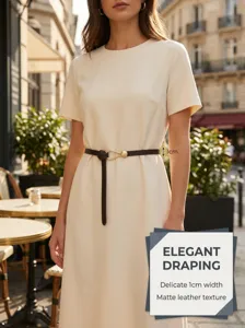 Elegant thin women's PU leather belt with minimalist teardrop metal buckle, detail view.