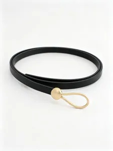 Detailed view of women thin black PU leather belt with elegant gold drop buckle for dress.