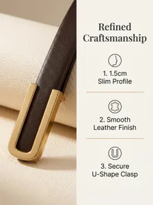 Detailed macro view of a 1.5cm slim brown leather belt featuring a gold U-shape clasp buckle