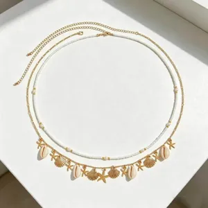 Bohemian multi-layer waist chain with shells and starfish, perfect beach body jewelry.