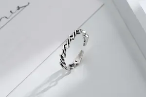 Detailed macro shot of vintage S925 sterling silver geometric rhombus open ring design