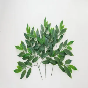 Close-up of high-quality artificial green mango leaves with realistic texture and veins