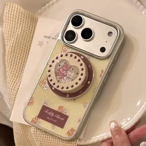 Detailed view of cream teddy bear phone case with magnetic glitter pop socket.