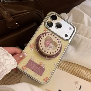 Detailed view of cream bear iPhone case with heart-shaped magnetic stand and hand