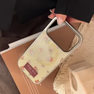 Detailed view of a cream phone case with a teddy bear pattern and magnetic kickstand.
