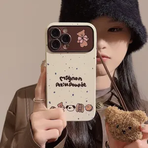 Detailed view of cute speckled iPhone case with plush bear charm and French text design