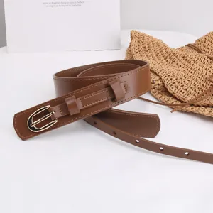 Close-up detail of the brown PU leather belt featuring a polished gold pin metal buckle.