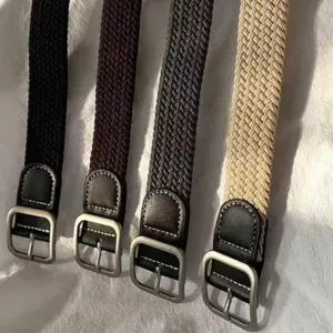 Casual braided canvas belt with metal pin buckle and PU leather ends for men and women.