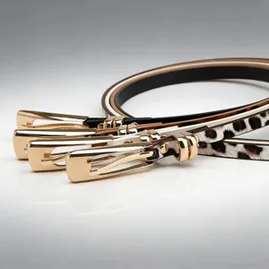 Detailed view of women thin leather belts with gold buckles in black brown and leopard styles.