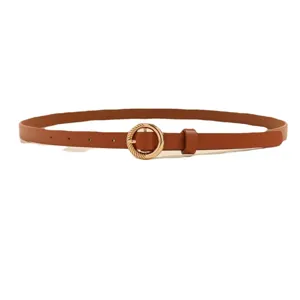 Women brown leather belt with round gold buckle fashion jeans waist accessory casual.