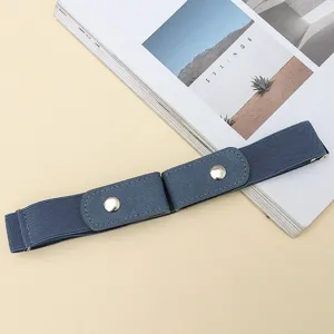 Detail shot of a minimalist blue elastic buckle-free lazy belt on magazine prop background.