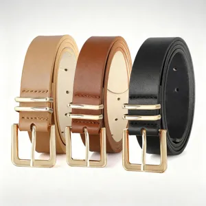 Detail shot of women's leather belts featuring gold square buckles and double loops design.