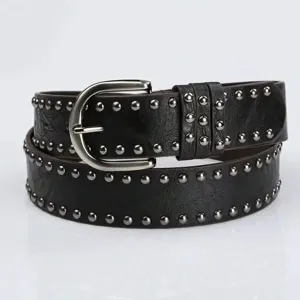 Detailed view of women black leather belt featuring punk silver studs and classic buckle