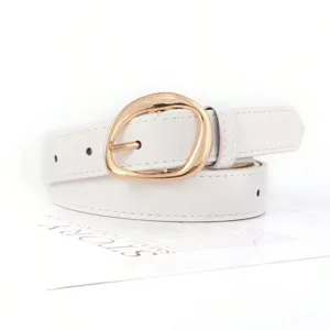 Close-up of a white faux leather belt featuring a polished gold irregular oval buckle.