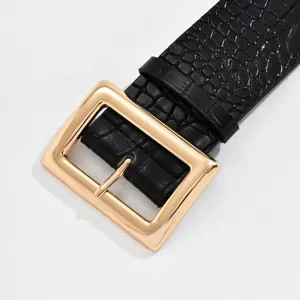 Black crocodile pattern wide belt detail, luxury gold square pin buckle fashion accessory.