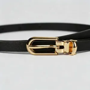 Slim black leather belt with gold metal buckle detail, elegant accessory for women dress suits.