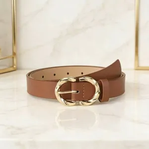 Detailed view of a stylish brown leather belt featuring an elegant gold C-buckle design.