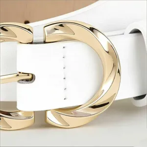 Close-up detail of white leather women belt with polished gold tone metal buckle accessory.