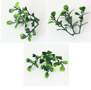 Artificial green plant leaves detail close-up view for interior wall garden decor.