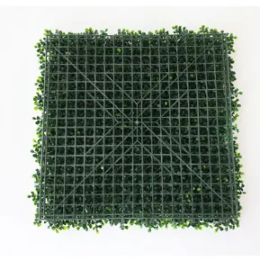 Artificial plant wall panel grid backing detail, dense green Milan grass turf for indoor decor.