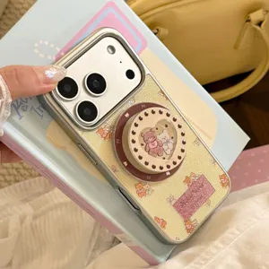 Detailed view of cream yellow magnetic bear phone case with heart-shaped stand