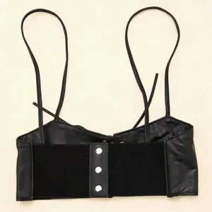 Detail view of black leather suspender corset belt with silver snaps and elastic band