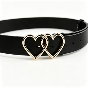 Close-up of black PU leather belt with interlocking gold heart buckles, stylish detail.