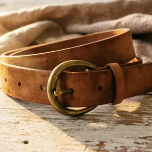 Vintage distressed caramel suede leather belt detail featuring antique bronze pin buckle.
