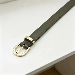Green PU leather belt for women, slim design with gold-tone metal pin buckle and keeper.