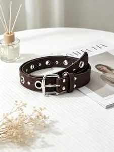 Dark brown punk grommet belt with silver metal buckle, versatile leather accessory for women.