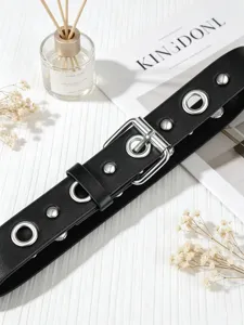 Punk style black leather belt with metal eyelets and silver buckle for women fashion daily wear.